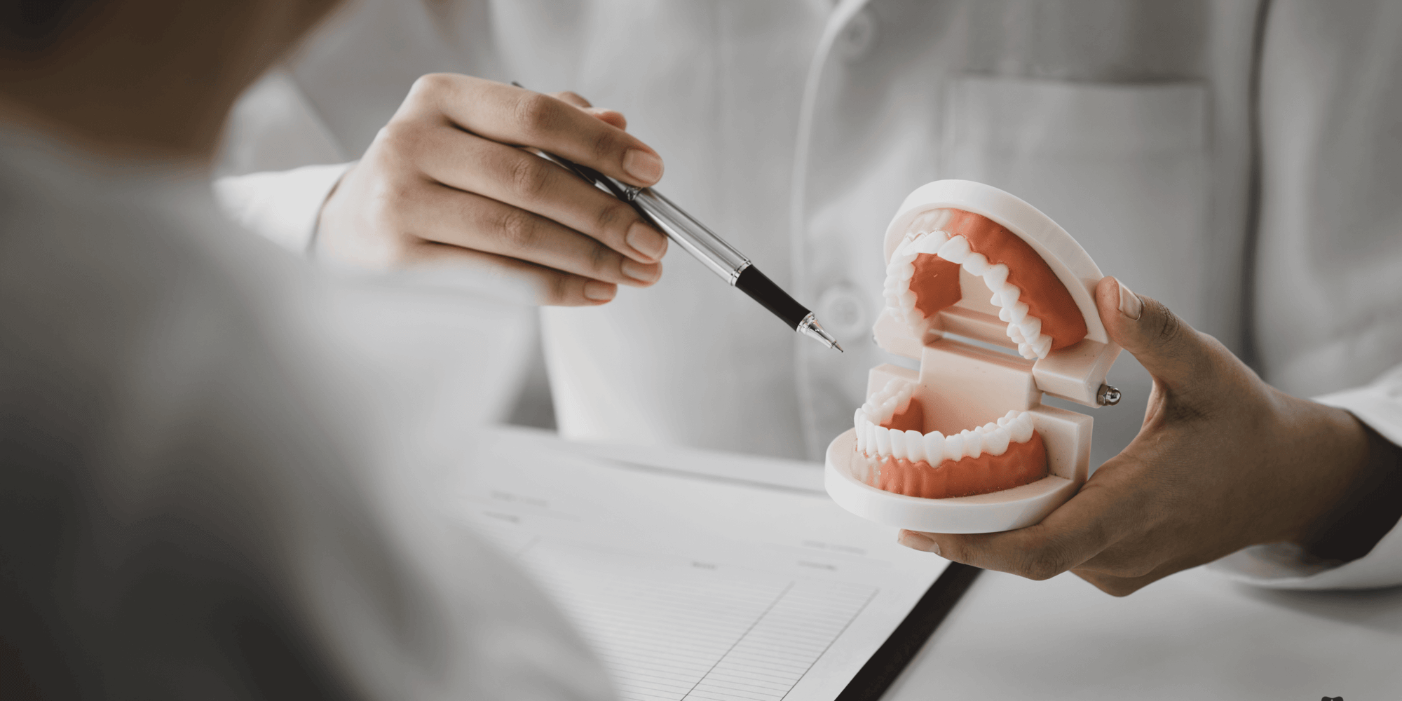 full mouth rehabilitation a dentist explaining dental recommendation to a patient
