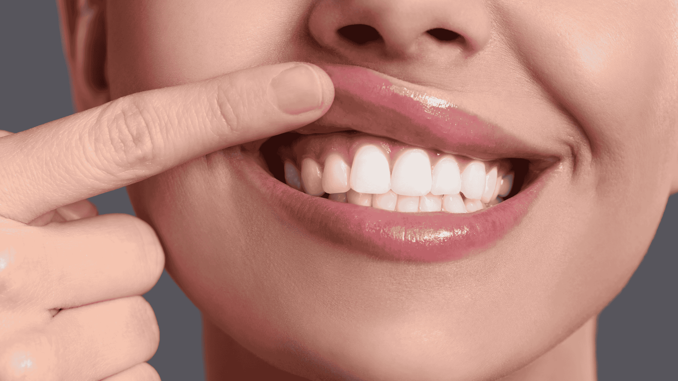 a woman showing a healthy gums